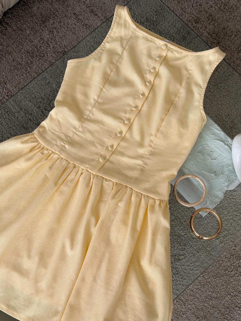 VESTIDO AMARILLO PASTEL EN LINO CORTO BOTONES