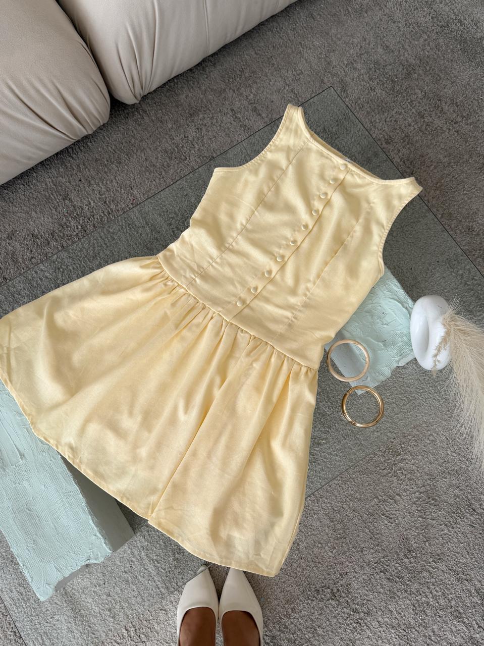 VESTIDO AMARILLO PASTEL EN LINO CORTO BOTONES